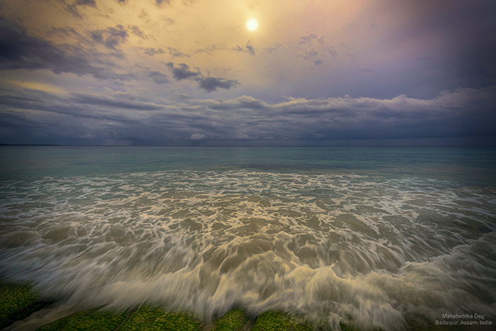 slow-shutter-speed catches wave motion